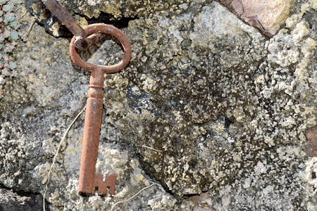 75585250 - very old door key in rusty iron